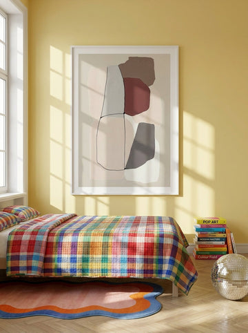 Modern wall art print styled on the wall in a colourful eclectic bedroom