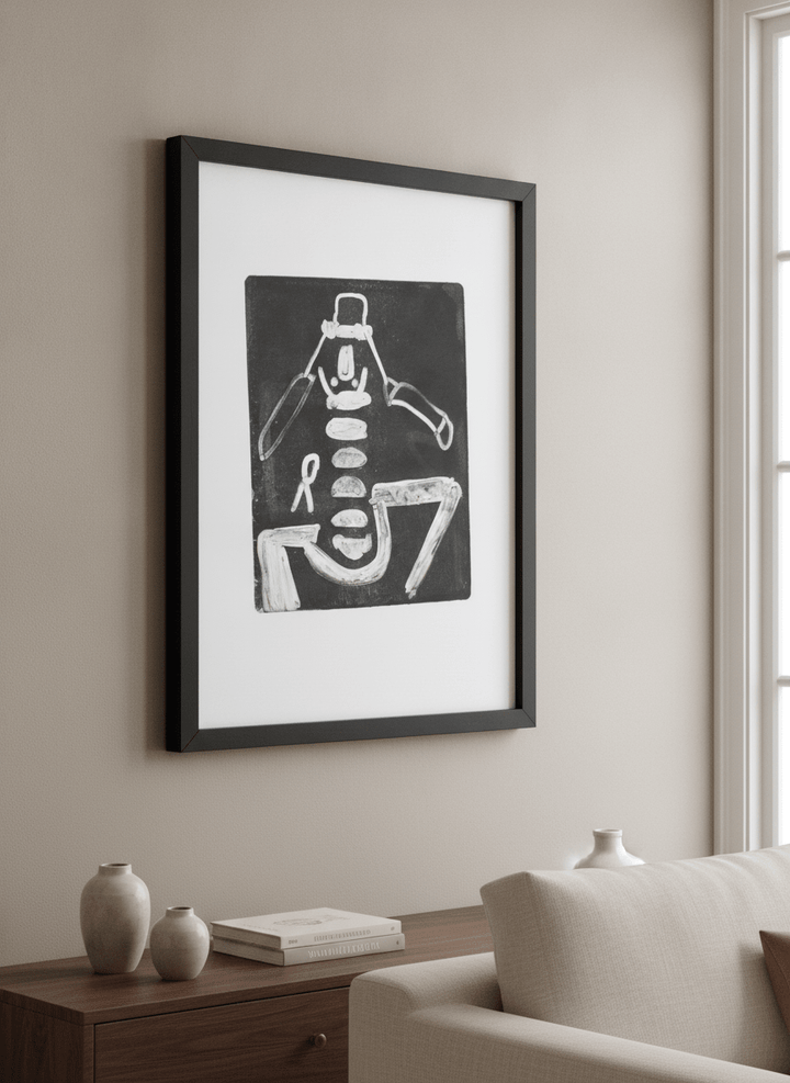 Modern wall art styled above a sofa in a neutral living room