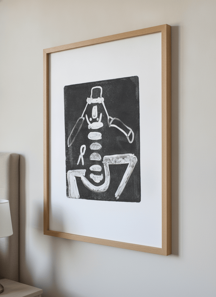 Minimalist artwork displayed in a calm, light-filled bedroom interior