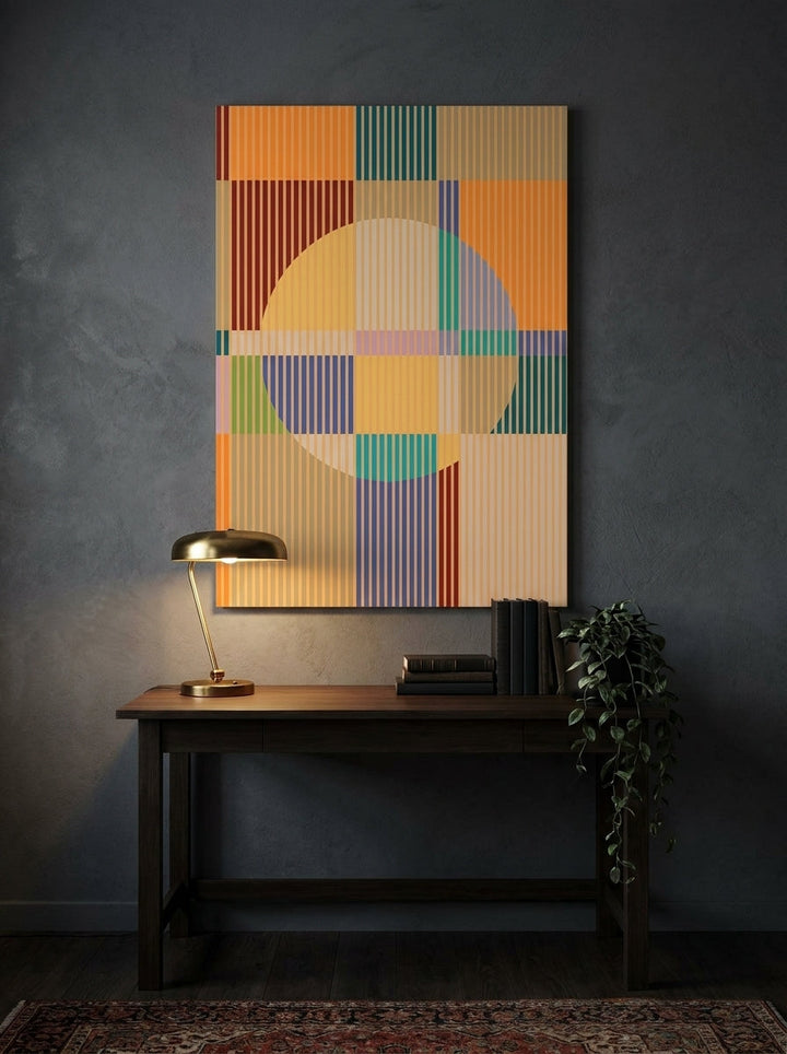 Stretched canvas wall art styled on the wall in a moody home office