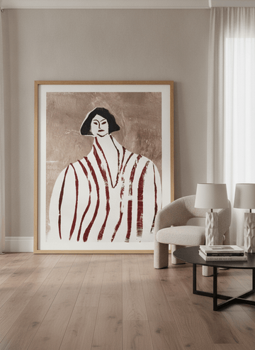 Oversized statement modern wall art print leaning against the wall in a luxe living room