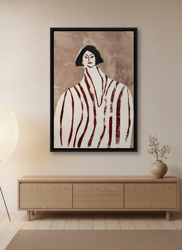 Canvas wall art with a black surround styled on the wall in a warm Japandi living room