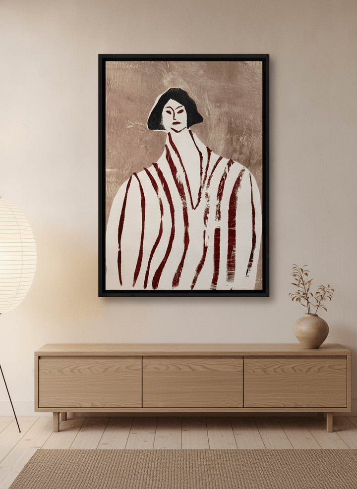 Canvas wall art with a black surround styled on the wall in a warm Japandi living room