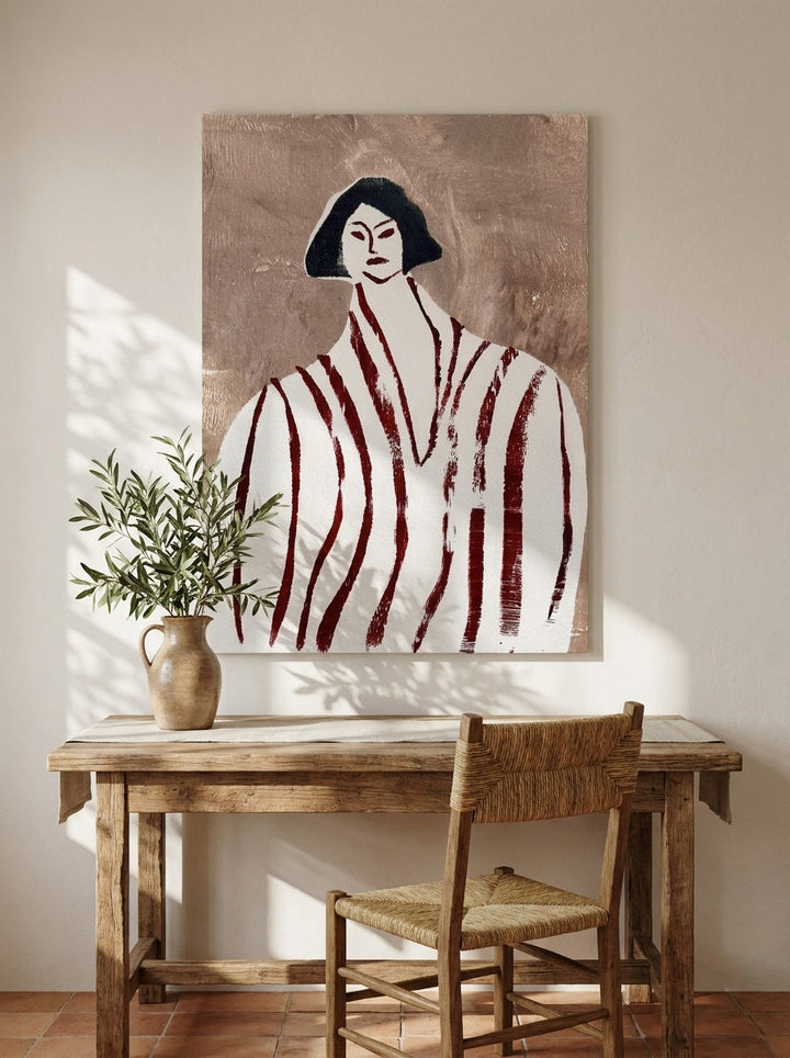 Stretched canvas wall art styled on the wall in a Mediterranean home office