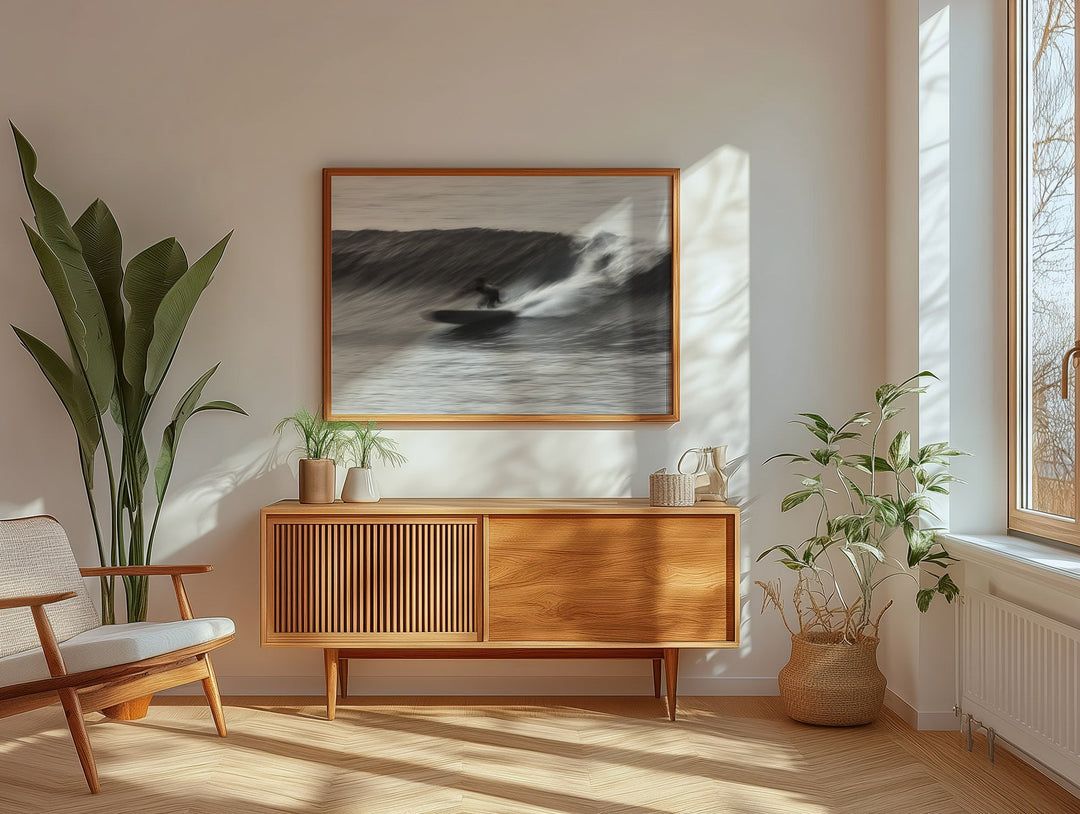 Modern living room with wooden cabinet, artwork, and plants.