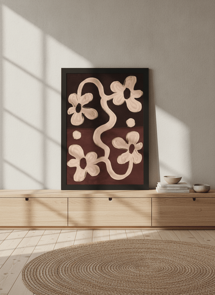 Modern wall art print standing on a sideboard in a warm Japandi bedroom