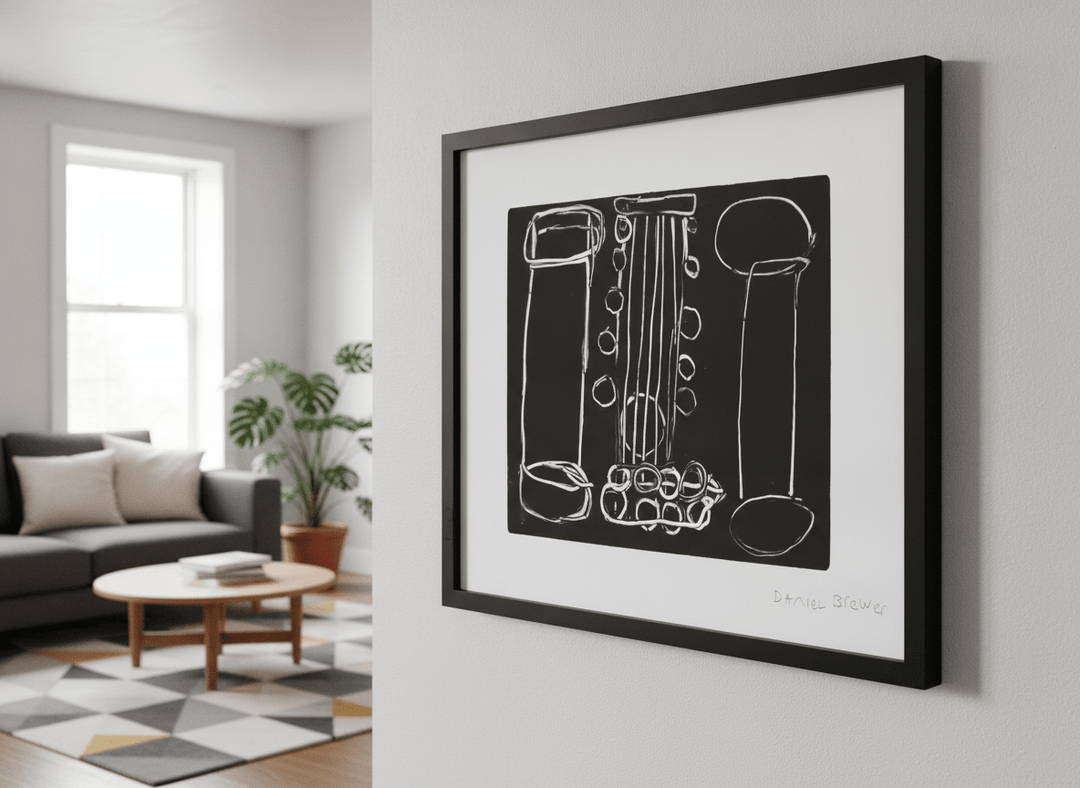 Modern wall art styled above a sofa in a neutral living room