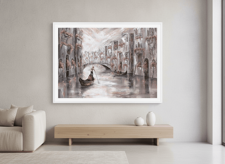 Modern wall art styled above a sofa in a neutral living room