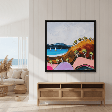 Oversized statement canvas wall art with a black surround styled in a sunny coastal beach house