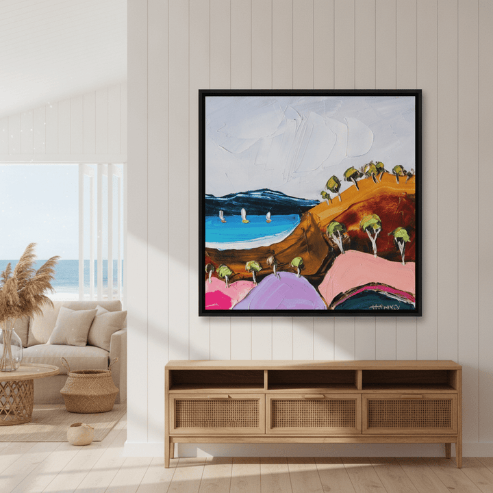 Oversized statement canvas wall art with a black surround styled in a sunny coastal beach house