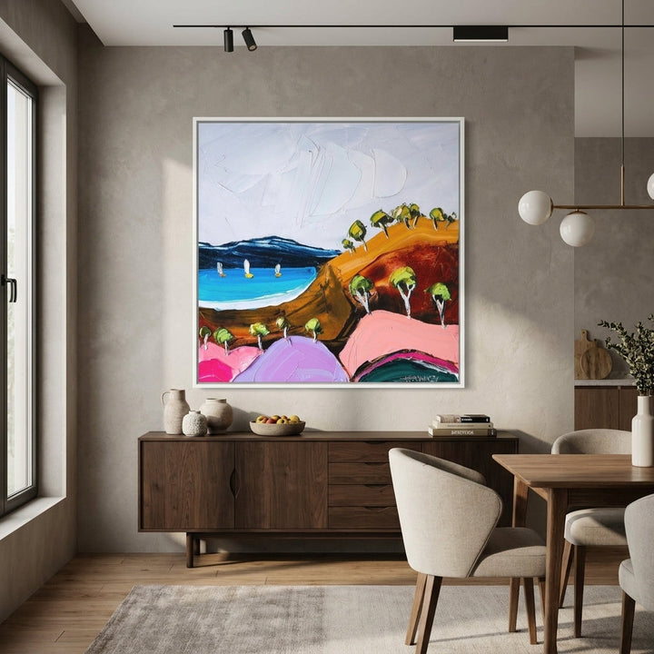 Canvas wall art with a white surround styled in a contemporary dining room