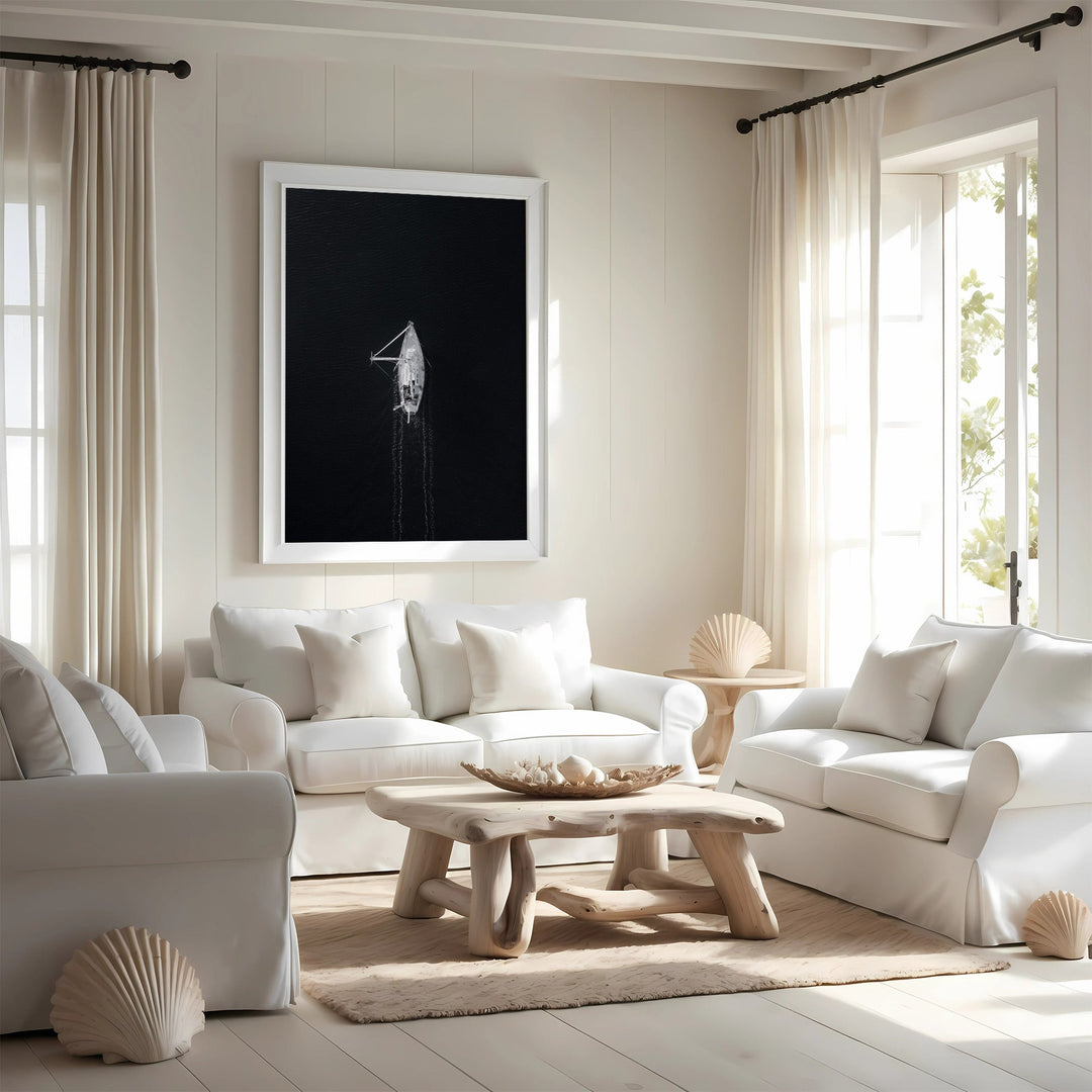 Modern living room with white furniture, a wooden coffee table, and decorative elements.