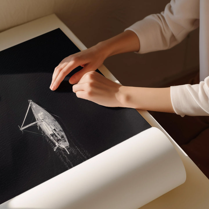 Person interacting with a digital drawing of a sailboat on a tablet.