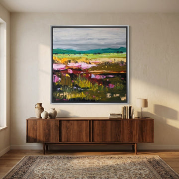 Canvas wall art with a silver leaf surround styled in a neutral living room