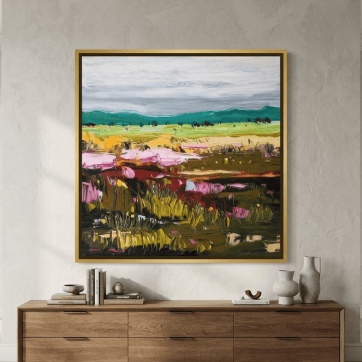 Oversized statement canvas wall art with a gold leaf surround styled in a luxe interior