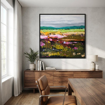 Canvas wall art with a black surround styled in a bright modern office