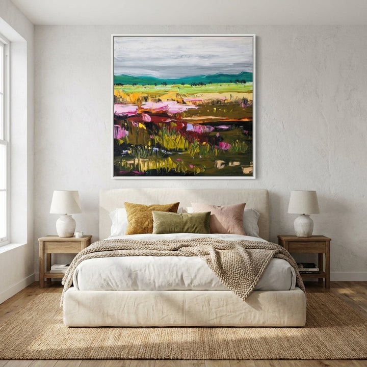Canvas wall art with a white surround styled in a calm, light-filled bedroom