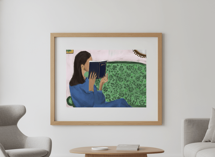 Modern wall art styled above a sofa in a neutral living room