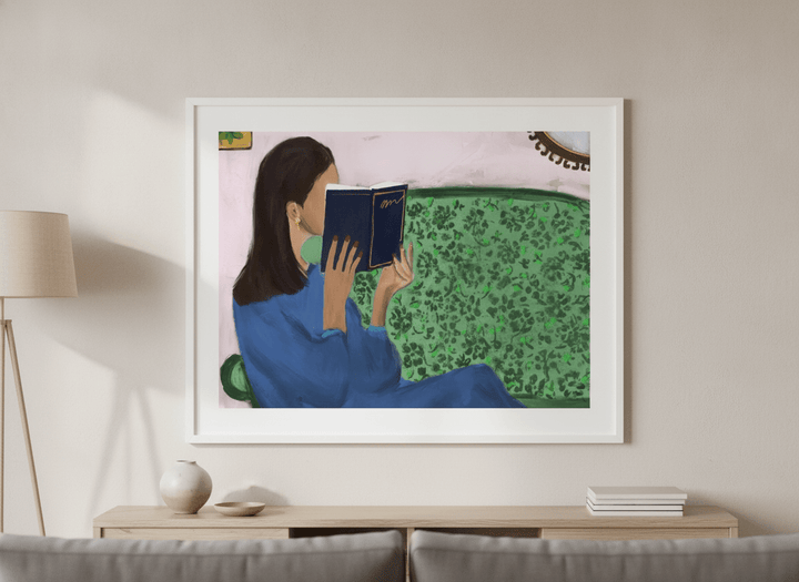 Modern wall art styled above a sofa in a neutral living room