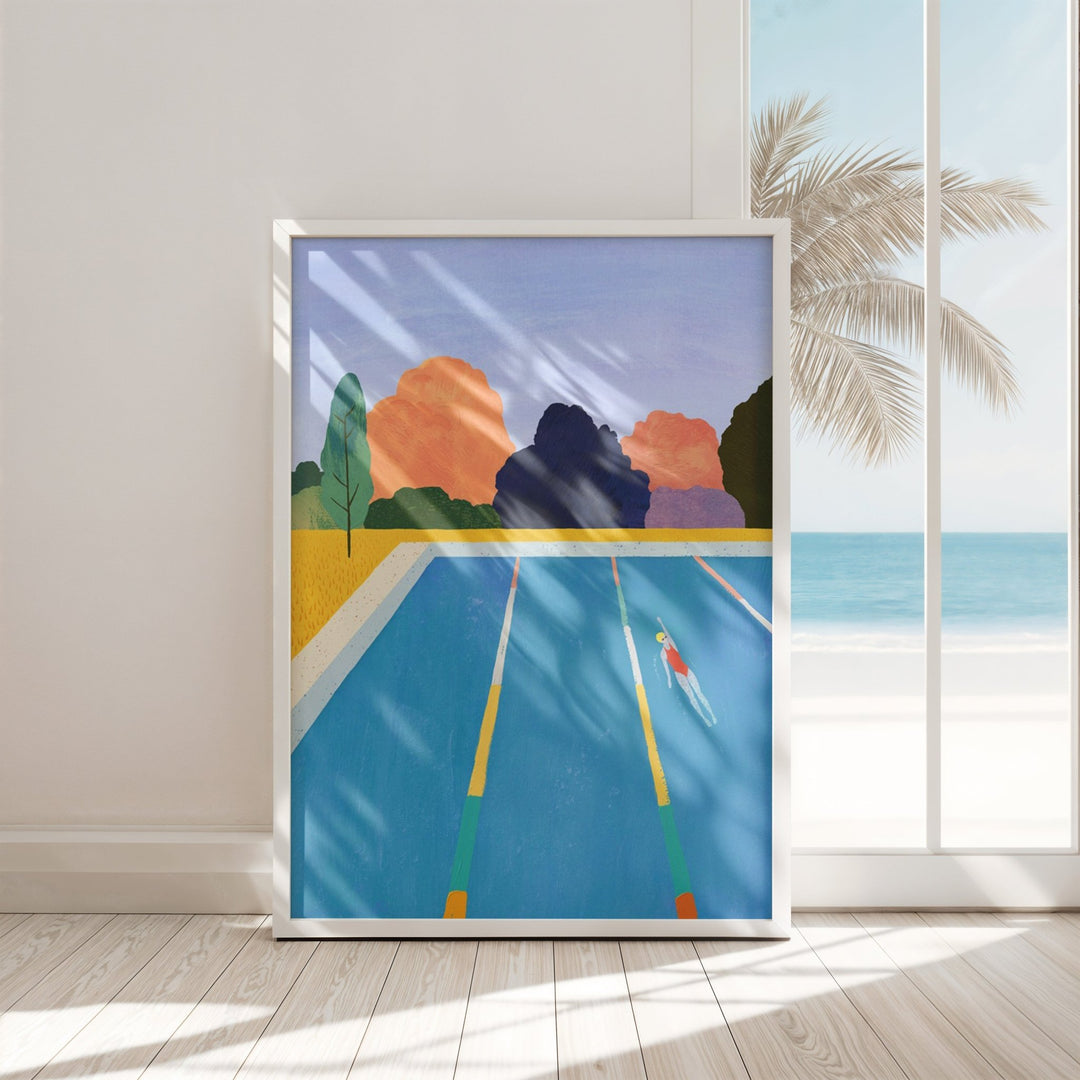 Artwork of a pool scene with palm trees and mountains on a wall.
