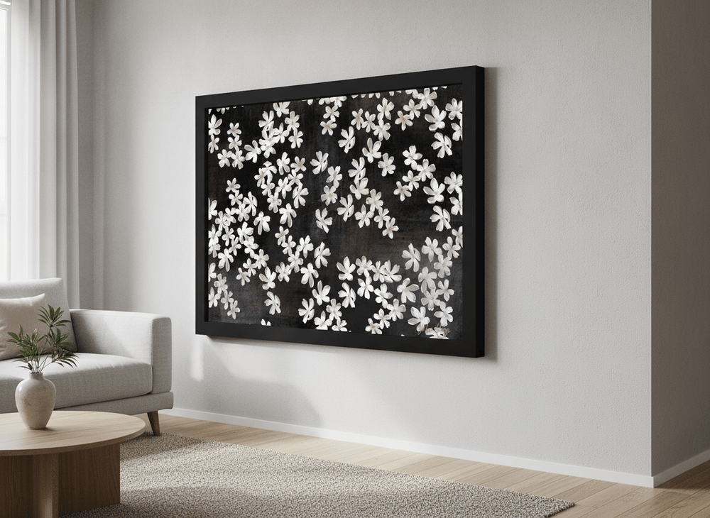 Modern wall art styled above a sofa in a neutral living room