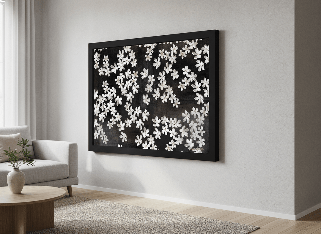 Modern wall art styled above a sofa in a neutral living room