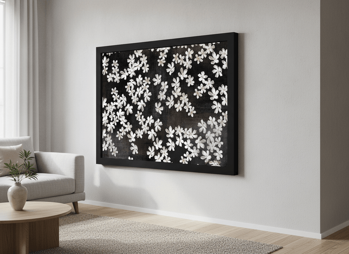 Modern wall art styled above a sofa in a neutral living room