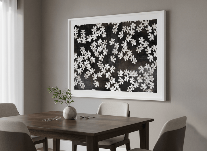 Wall art styled above a dining table in a contemporary home