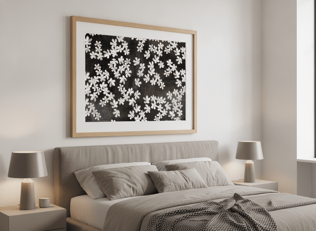 Minimalist artwork displayed in a calm, light-filled bedroom interior