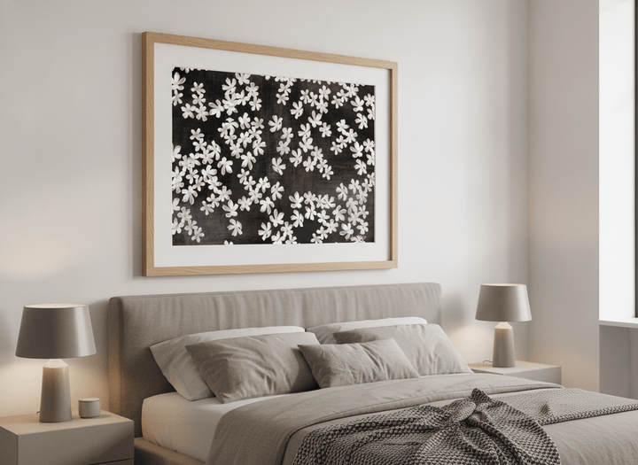 Minimalist artwork displayed in a calm, light-filled bedroom interior