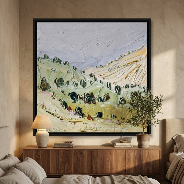 Canvas wall art with a black surround styled in a calm, light-filled bedroom