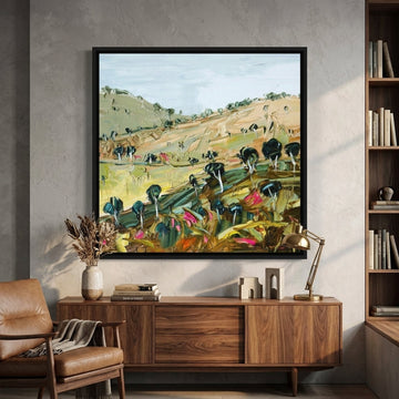 Canvas wall art with a black surround styled in a bright modern office