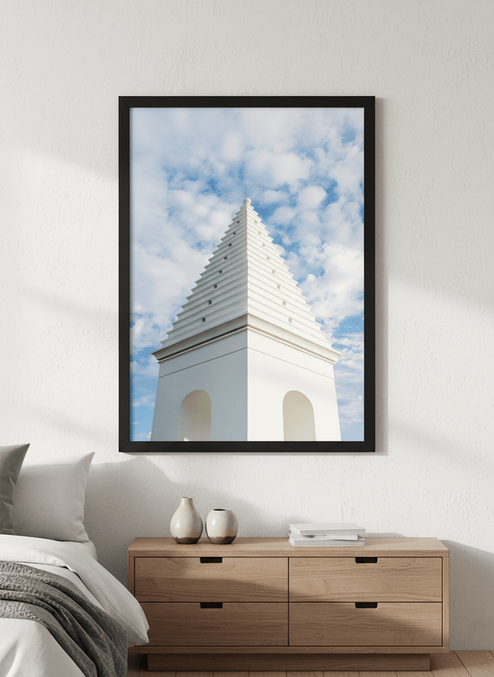 Minimalist artwork displayed in a calm, light-filled bedroom interior