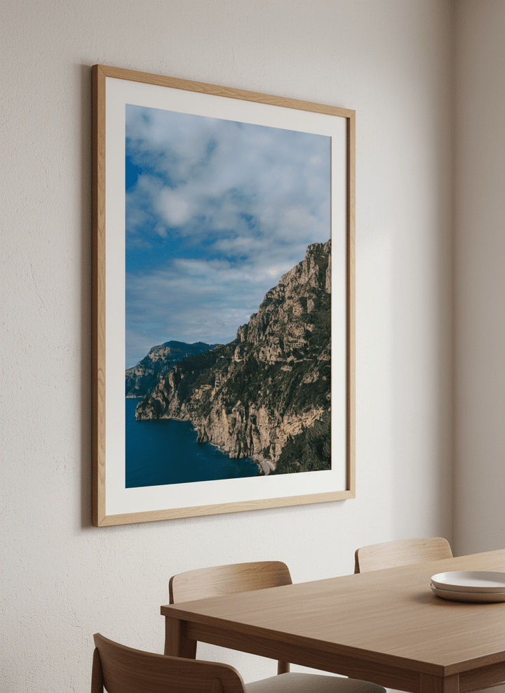 Wall art styled above a dining table in a contemporary home