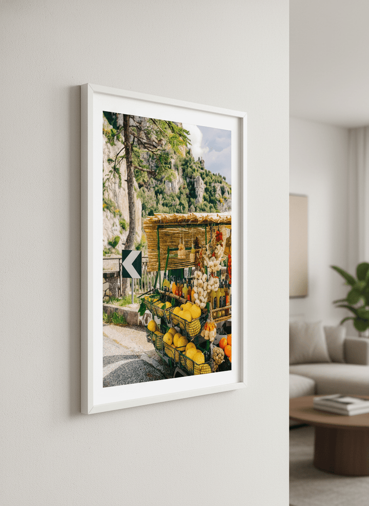 Modern wall art styled above a sofa in a neutral living room