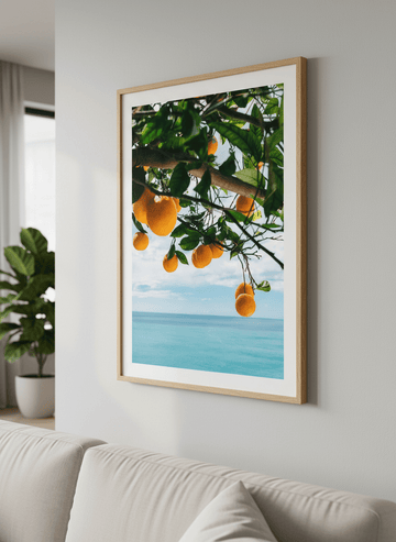 Modern wall art styled above a sofa in a neutral living room