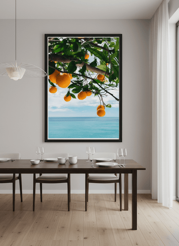 Wall art styled above a dining table in a contemporary home
