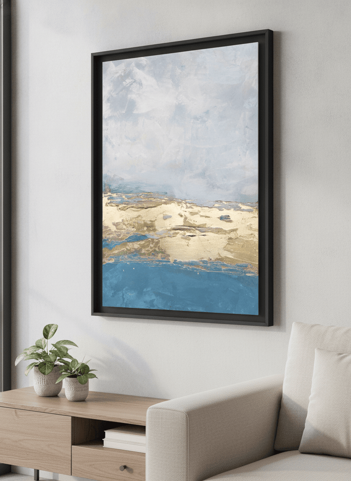 Modern wall art styled above a sofa in a neutral living room