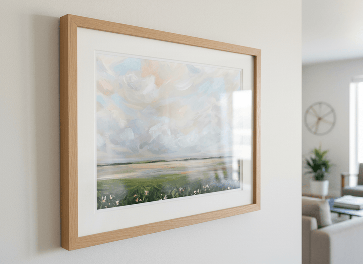Modern wall art styled above a sofa in a neutral living room