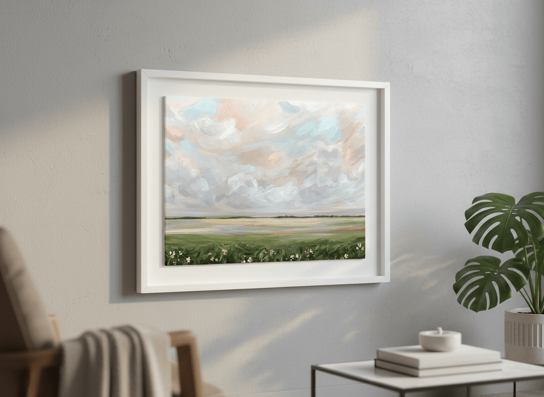 Modern wall art styled above a sofa in a neutral living room