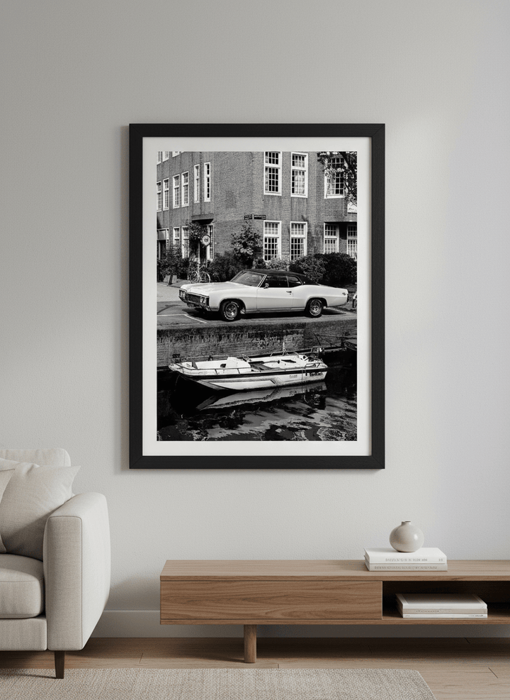 Modern wall art styled above a sofa in a neutral living room
