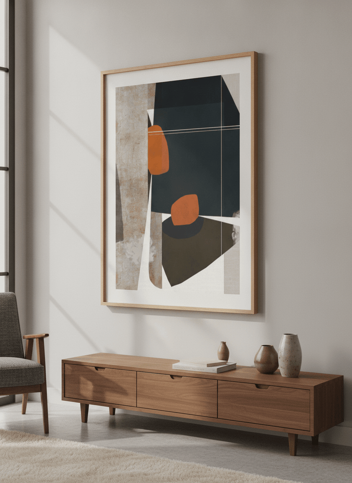 Modern wall art styled above a sofa in a neutral living room