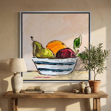 Canvas wall art with a silver leaf surround styled in a neutral living room
