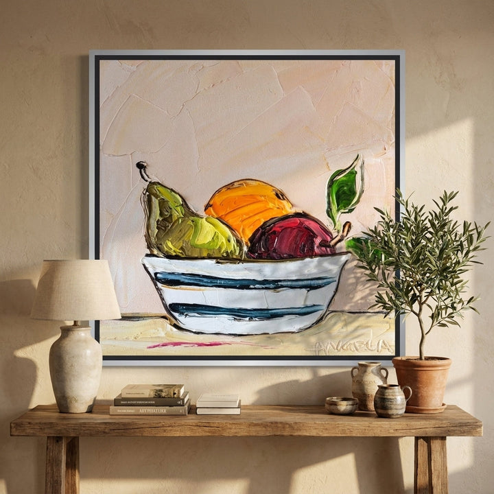 Canvas wall art with a silver leaf surround styled in a neutral living room