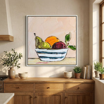 Canvas wall art with a white surround styled in a bright modern kitchen