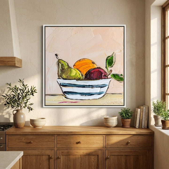 Canvas wall art with a white surround styled in a bright modern kitchen