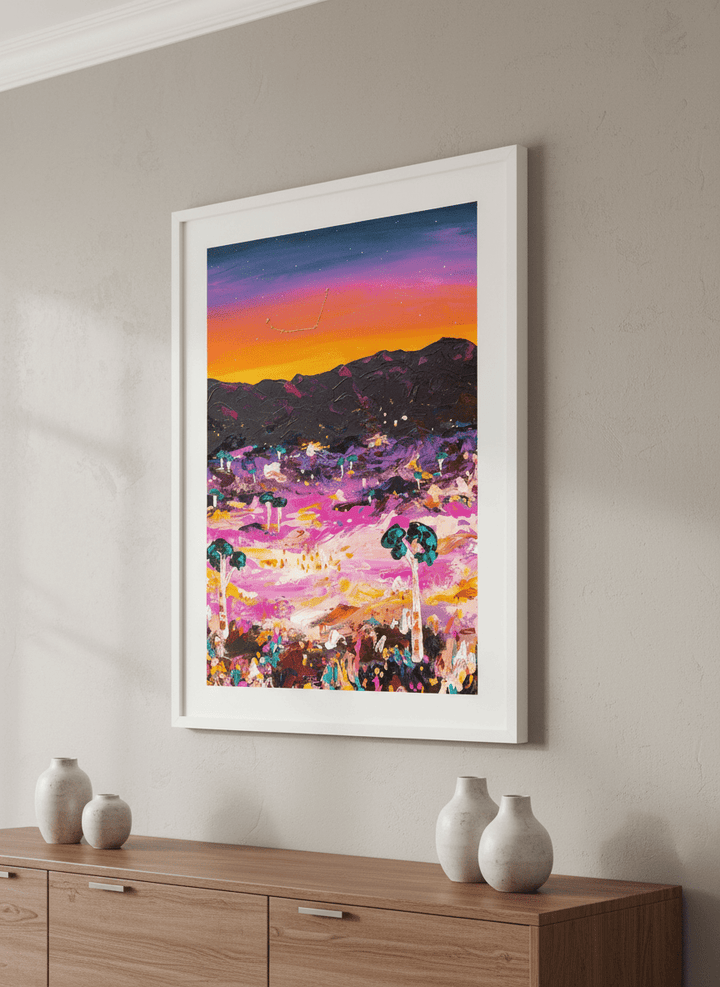 Wall art styled above a dining table in a contemporary home