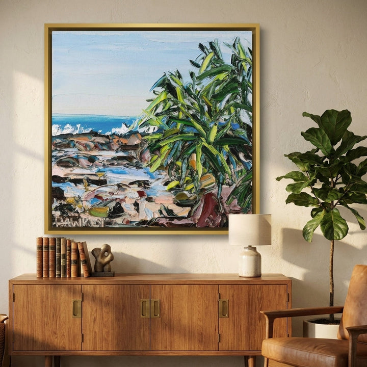 Canvas wall art with a gold leaf surround styled in a bright modern office