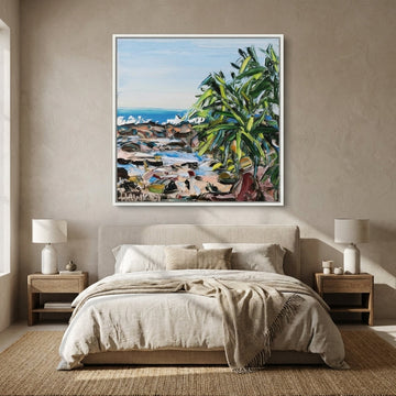 Canvas wall art with a white surround styled in a calm, light-filled bedroom