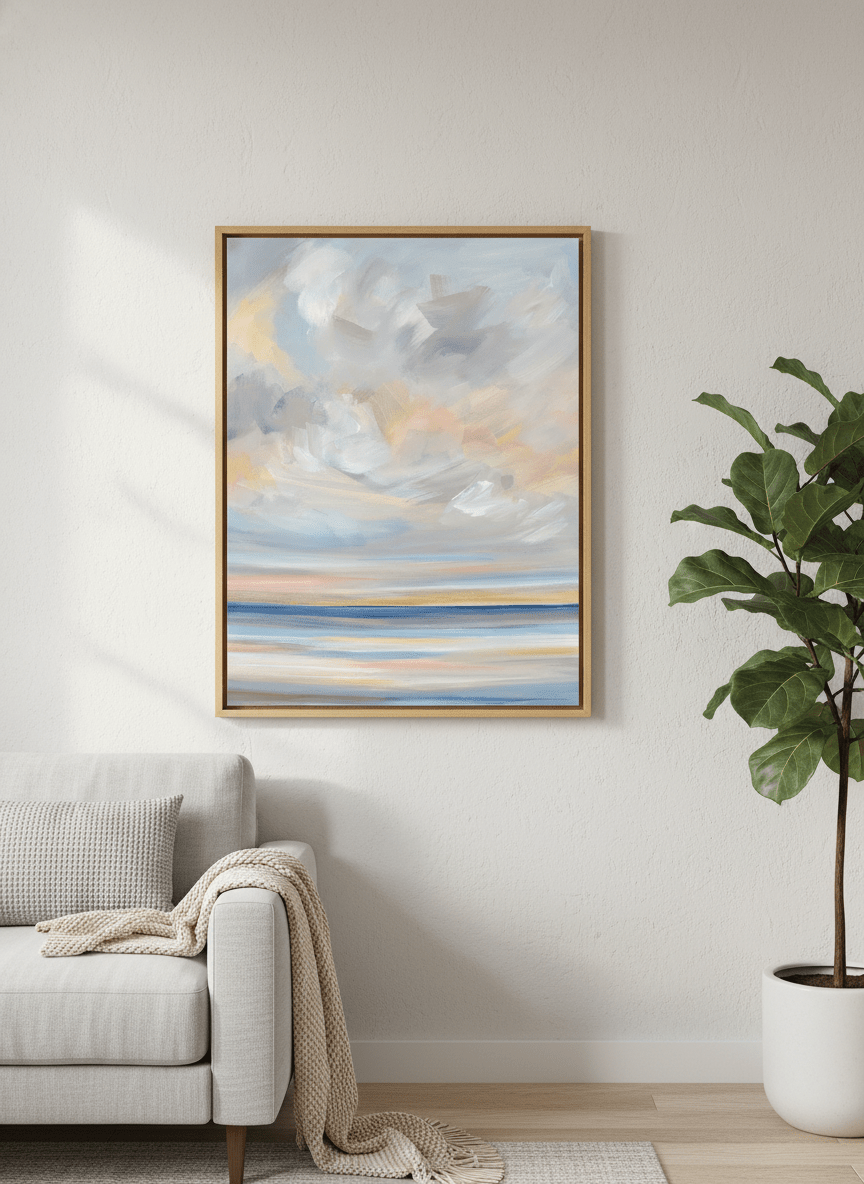 Modern wall art styled above a sofa in a neutral living room